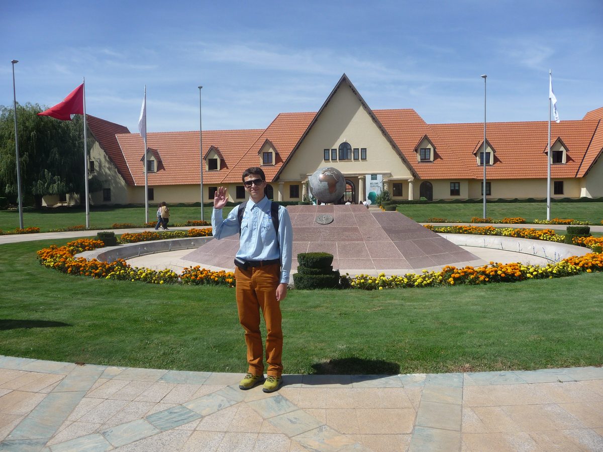 Reese Hollister standing on the campus of Al-Akhawayn University (AUI) in Ifrane, Morocco — a 1930s French colonial hill station, now an English-language university.